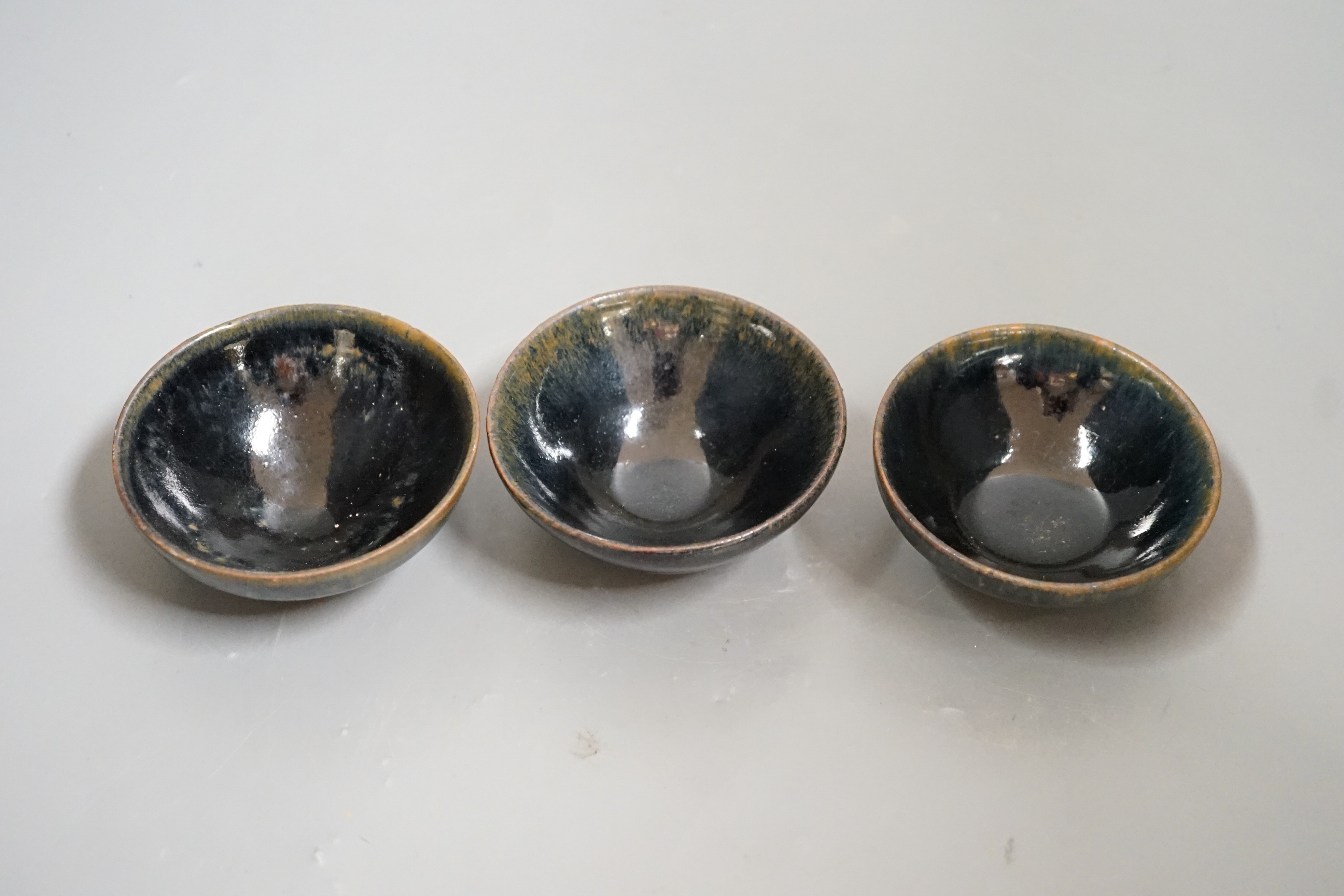 Three Chinese Jian type hare's fur bowls, 9cms diameter